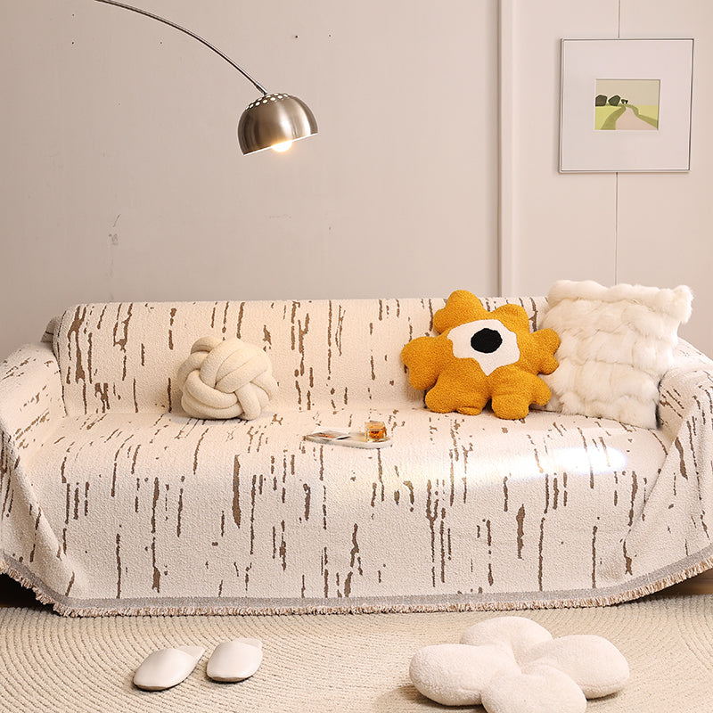 Jeté de canapé en coton naturel sur un canapé beige