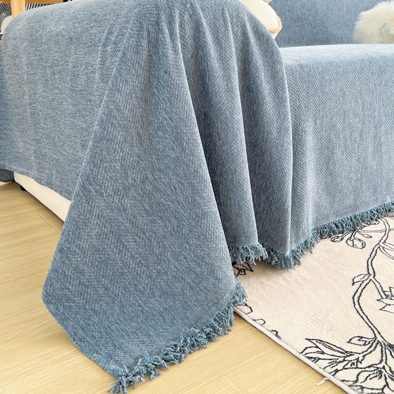 Détail des motifs tissés sur le jeté de canapé