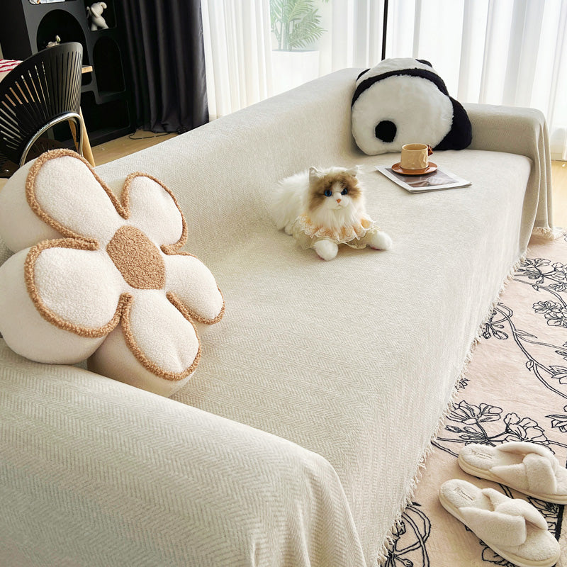Jeté de canapé en coton naturel sur un canapé beige
