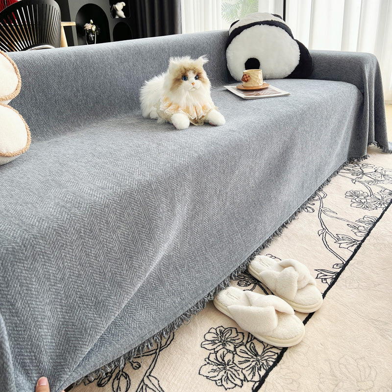 Jeté de canapé drapé sur un fauteuil