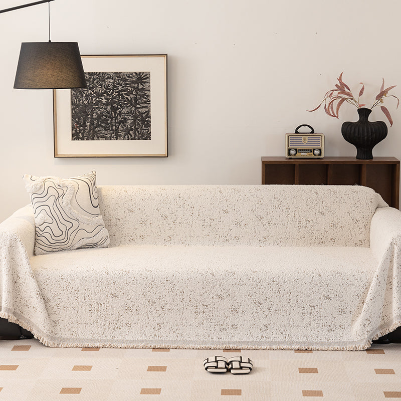 Jeté de canapé en coton naturel sur un canapé beige