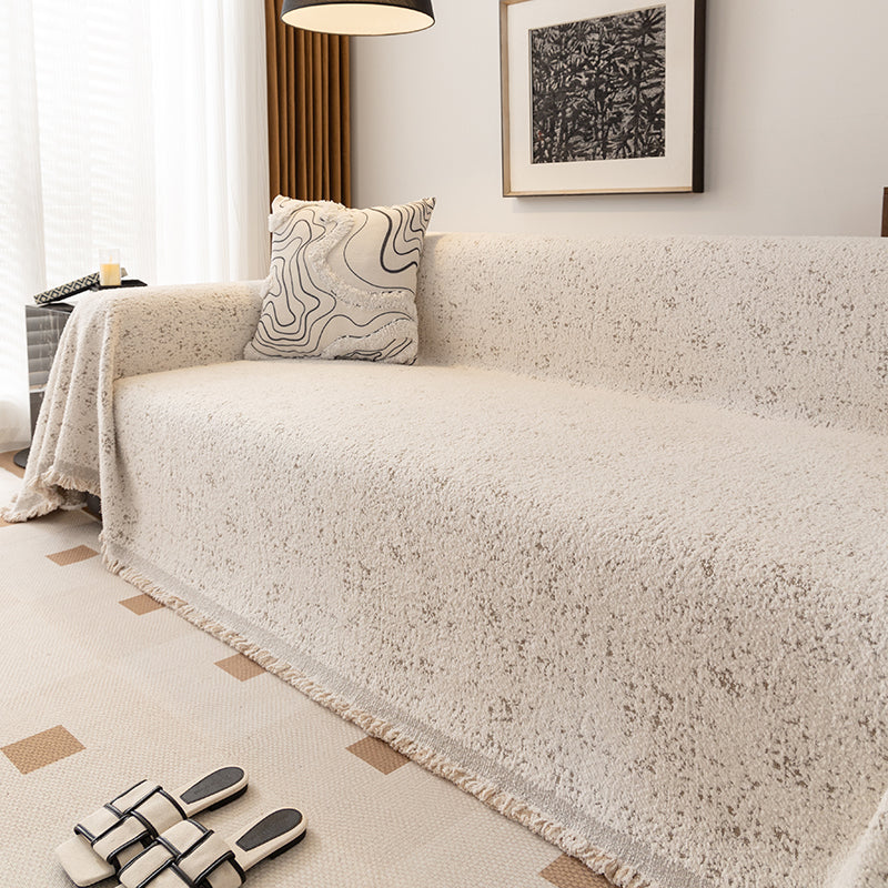 Jeté de canapé couvrant un fauteuil, texture détaillée