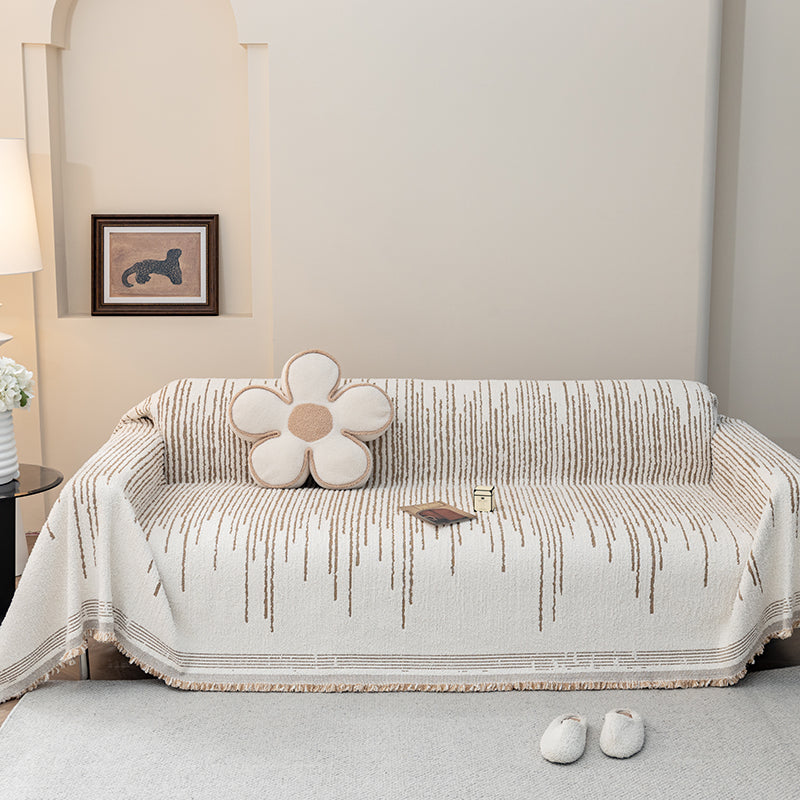 Jeté de canapé en coton naturel sur un canapé beige