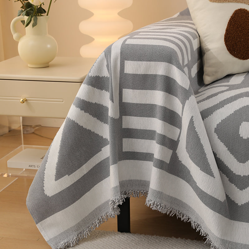 Motifs géométriques sur fond gris, style bohème