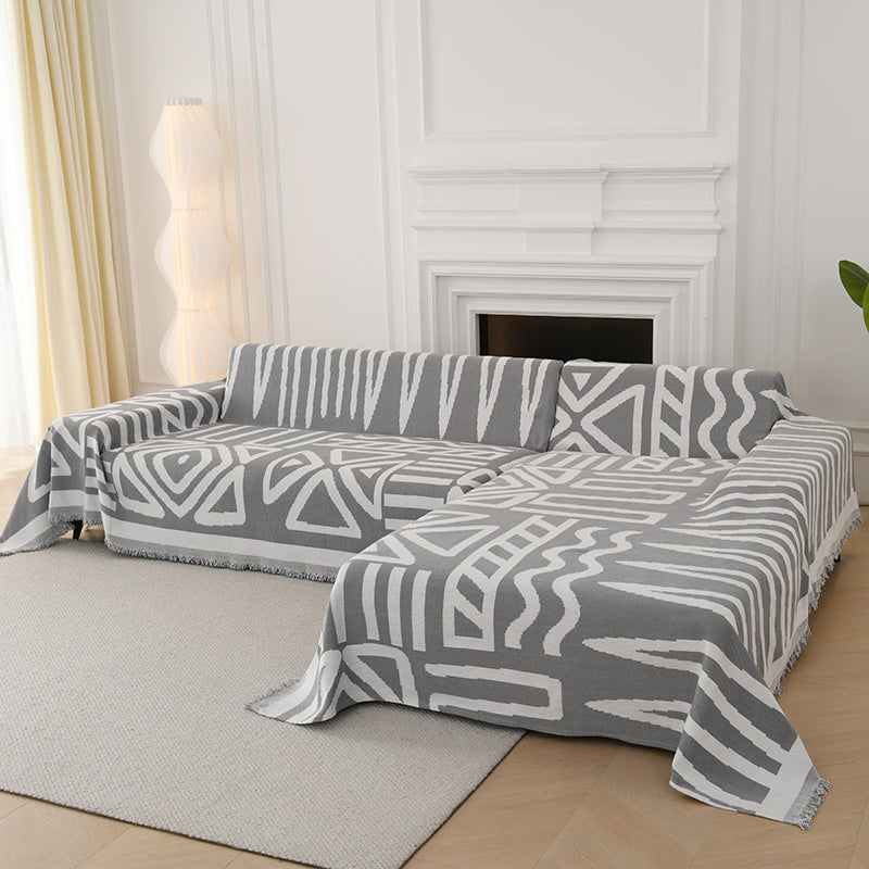 Jeté de canapé gris avec motifs tribaux tissés