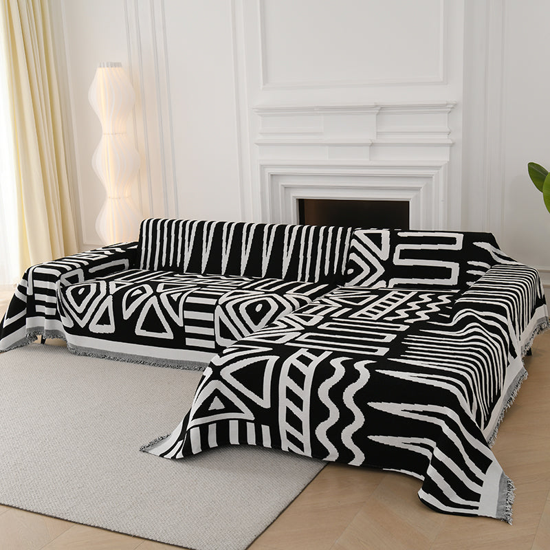 Jeté de canapé avec motifs tribaux noirs en gros plan