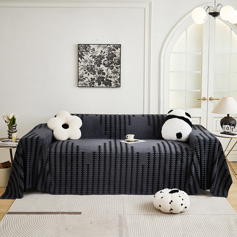 Jeté en chenille couvrant un canapé, ambiance cocooning
