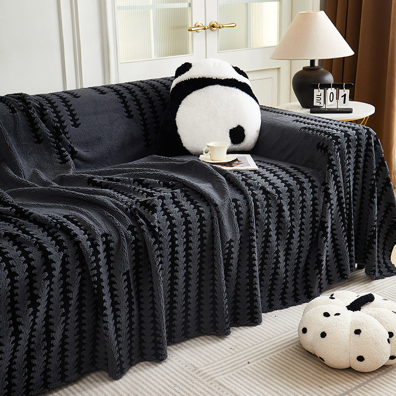 Gros plan sur la texture boucles 3D du jeté en chenille