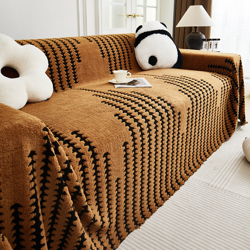 Détail des fibres résistantes du jeté de canapé marron