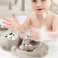 Ensemble de loutres flottantes en silicone dans une baignoire