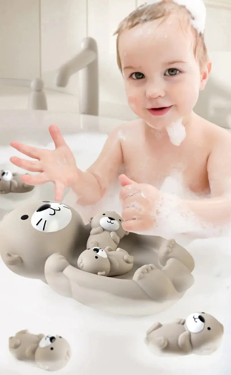 Ensemble de loutres flottantes en silicone dans une baignoire