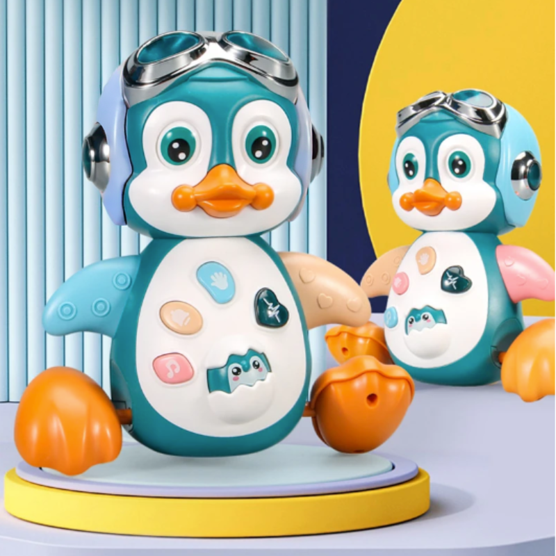 Enfant jouant avec un pingouin interactif lumineux et sonore