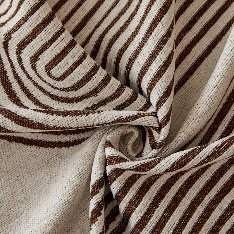Jeté de canapé plié, montrant la texture et les motifs