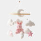 Mobile musical avec lapin rose suspendu