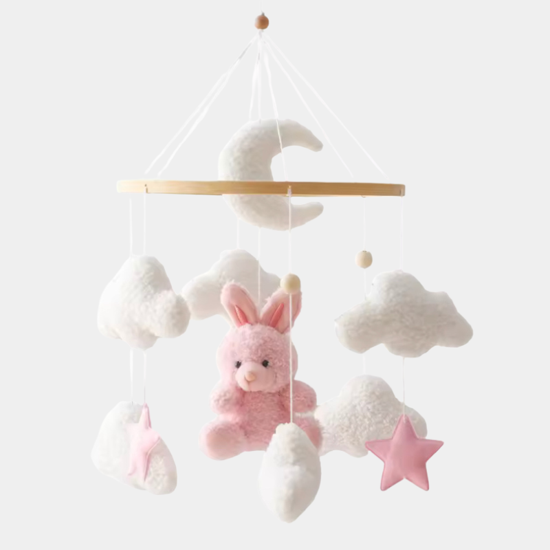 Mobile musical avec lapin rose suspendu