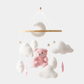Mobile musical avec ours rose suspendu