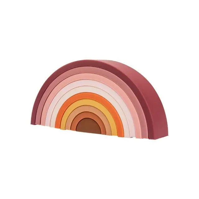 Arc-en-ciel en bois pastel partiellement assemblé sur une surface
