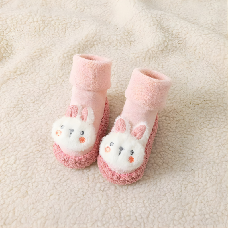 Chaussures chaussettes bébé roses, vue de côté