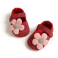 Chaussures bébé rouges avec motifs de fleurs