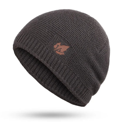 Emblème feuille en cuir sur bonnet, touche naturelle