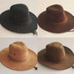 Détail du cordon sur un chapeau cowboy en cuir brun