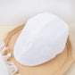 Vue de dessus d'un béret en coton, détails du tissage