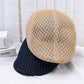 Gros plan sur un béret noir avec texture en feutre