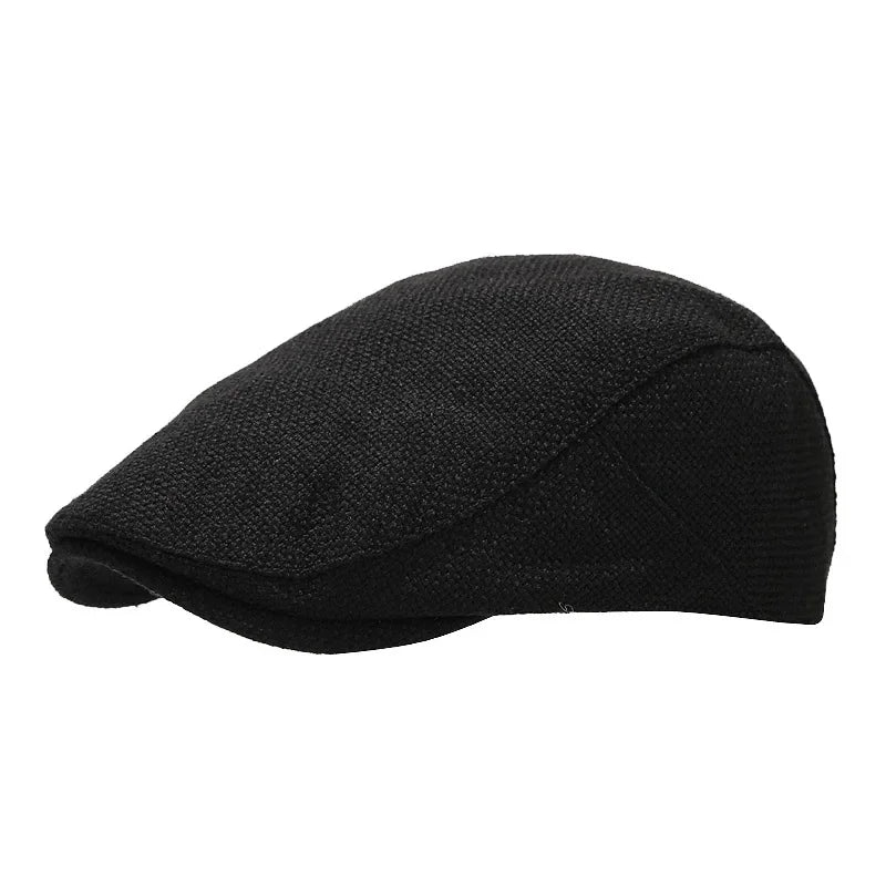 Silhouette d'un homme avec béret noir, arrière-plan flou