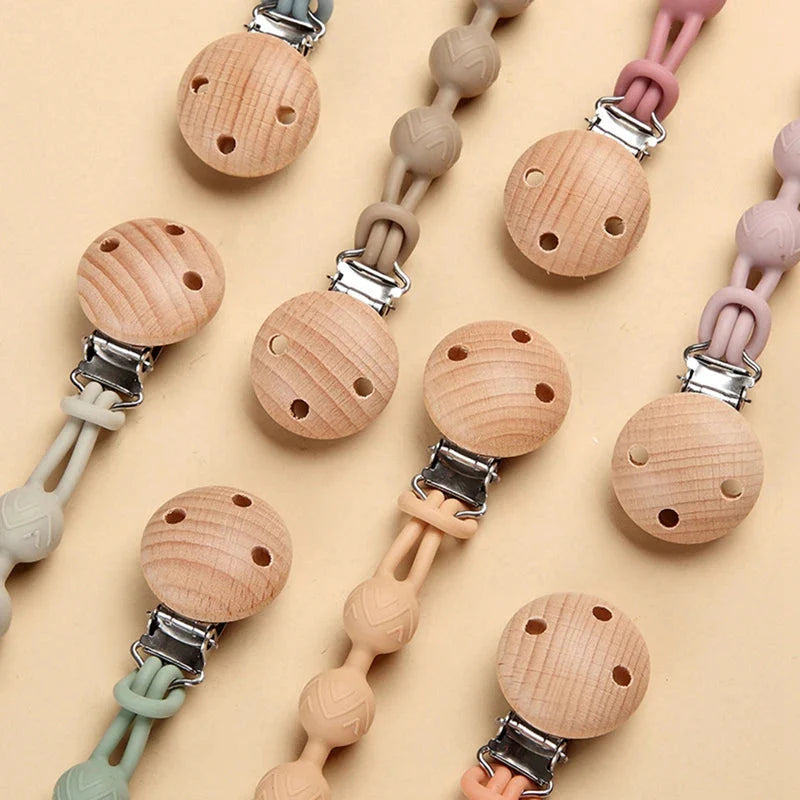Perles de silicone texturées sur l'attache sucette pour dentition