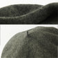 Béret basque avec une étiquette indiquant sa taille