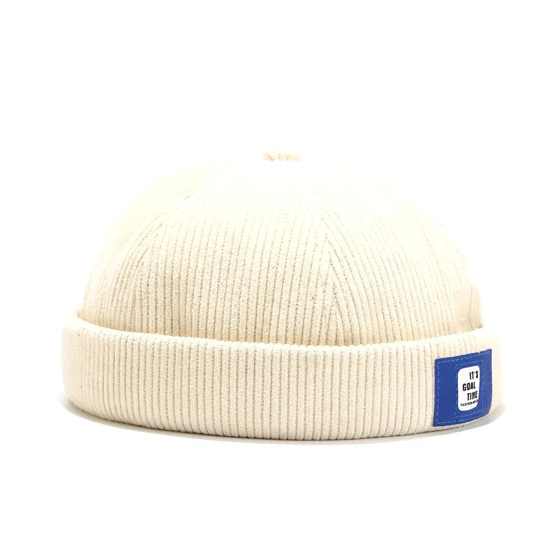 Détail du tissu velours côtelé bleu, bonnet rétro