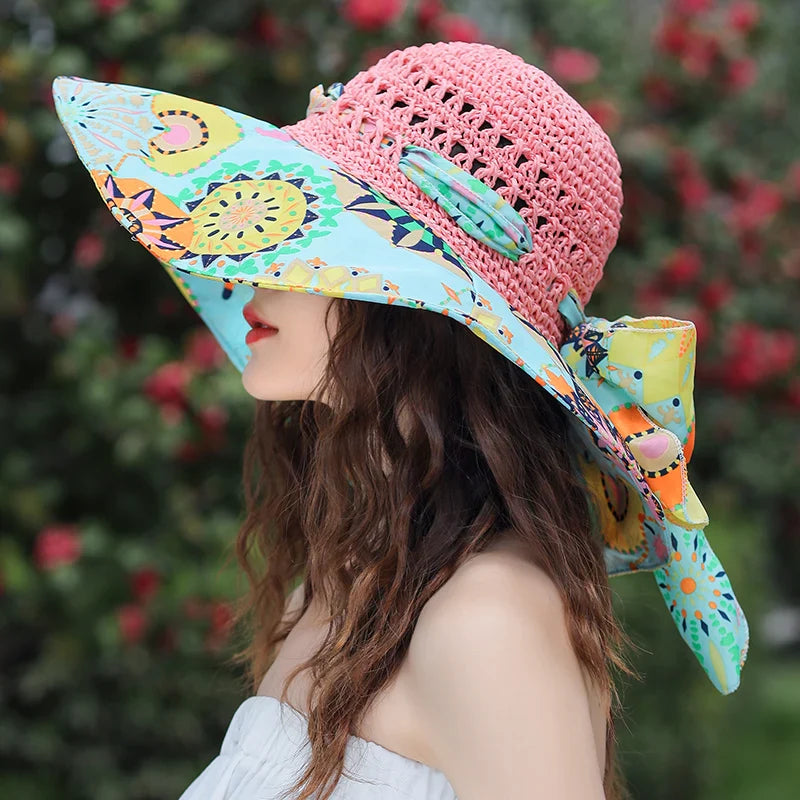 Chapeau de paille avec ruban noir sur fond blanc