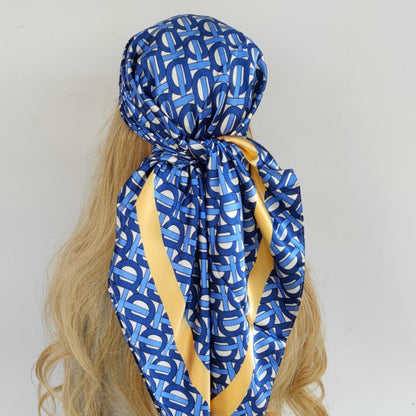 Foulard élégant en soie avec motifs géométriques colorés