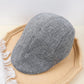 Béret en coton plié, montrant la doublure intérieure