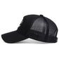 Gros plan sur la broderie smiley d'une casquette