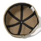 Détail de la texture usée d'un bonnet Docker beige