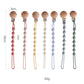 Attache sucette avec clip en bois et perles pastel