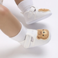 Chaussures bébé blanches avec doublure respirante et sangle ajustable