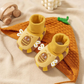 Chaussures bébé jaunes avec design animal et semelle sécurisée