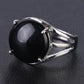 Bague élégante avec cabochon en pierre jaune sertie