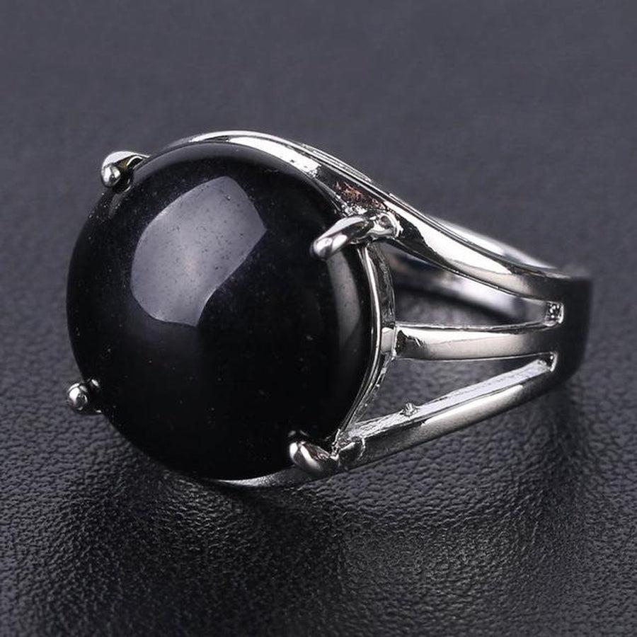Bague élégante avec cabochon en pierre jaune sertie