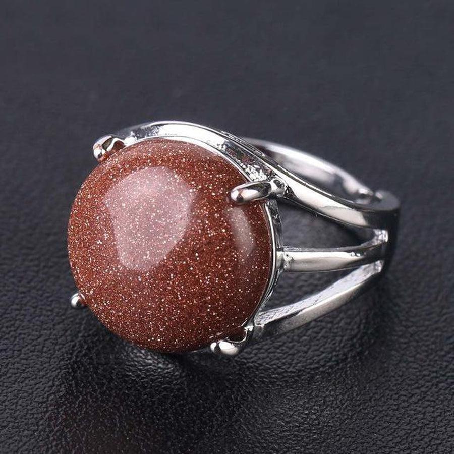 Bague avec cabochon en pierre rose et griffes