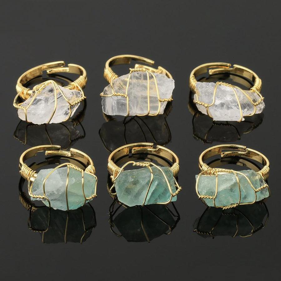 Cristal blanc monté sur une bague réglable en métal argenté
