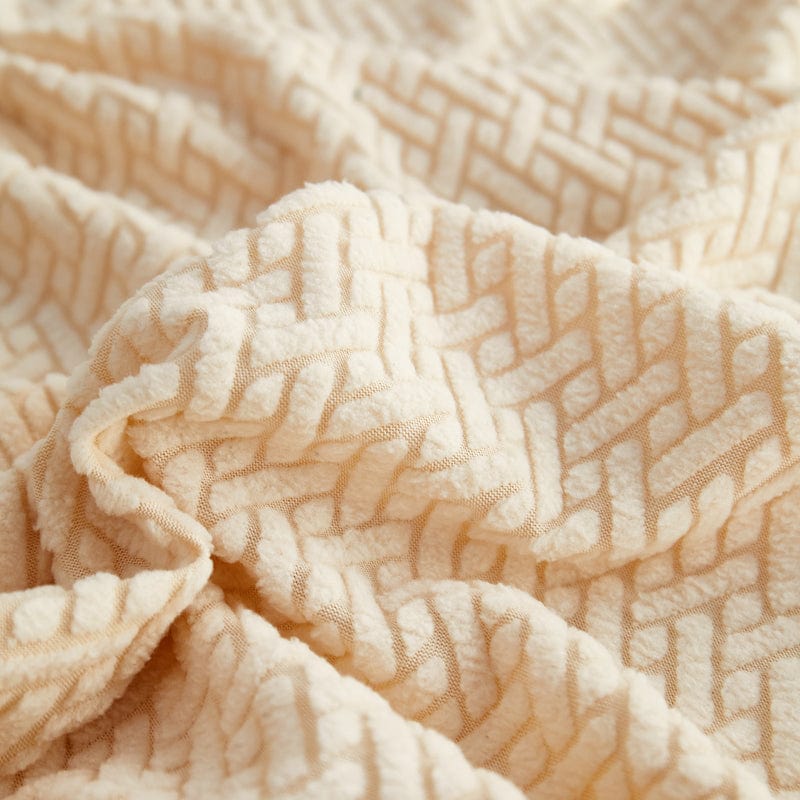Détail du motif laine sur une housse polaire beige