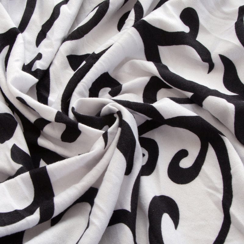 Housse de coussin avec motif géométrique en noir et blanc