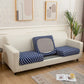 Housse de coussin bleue à pois blancs sur canapé