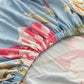 Motif floral bleu ciel sur housse de coussin extensible