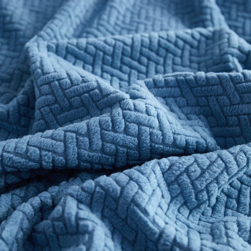 Détail de la texture laineuse d'une housse polaire bleue ciel