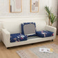 Housse de coussin bleue à motif floral sur canapé