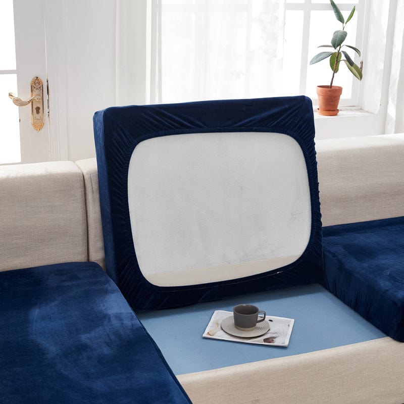 Vue latérale d'un canapé recouvert de velours bleu